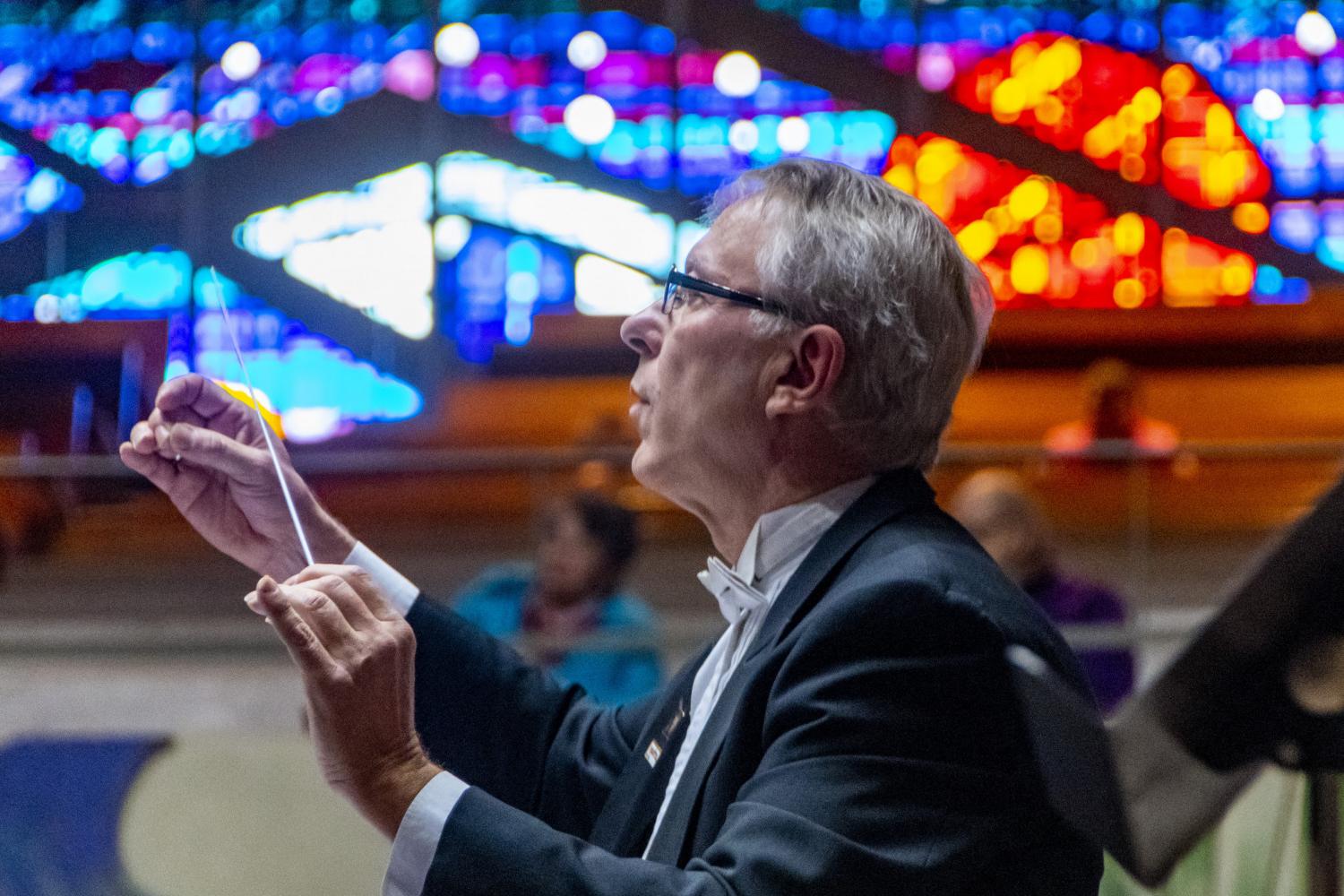 Carthage music professor Jim Ripley conducts the Carthage Wind Orchestra in the A. F. Siebert Chapel.